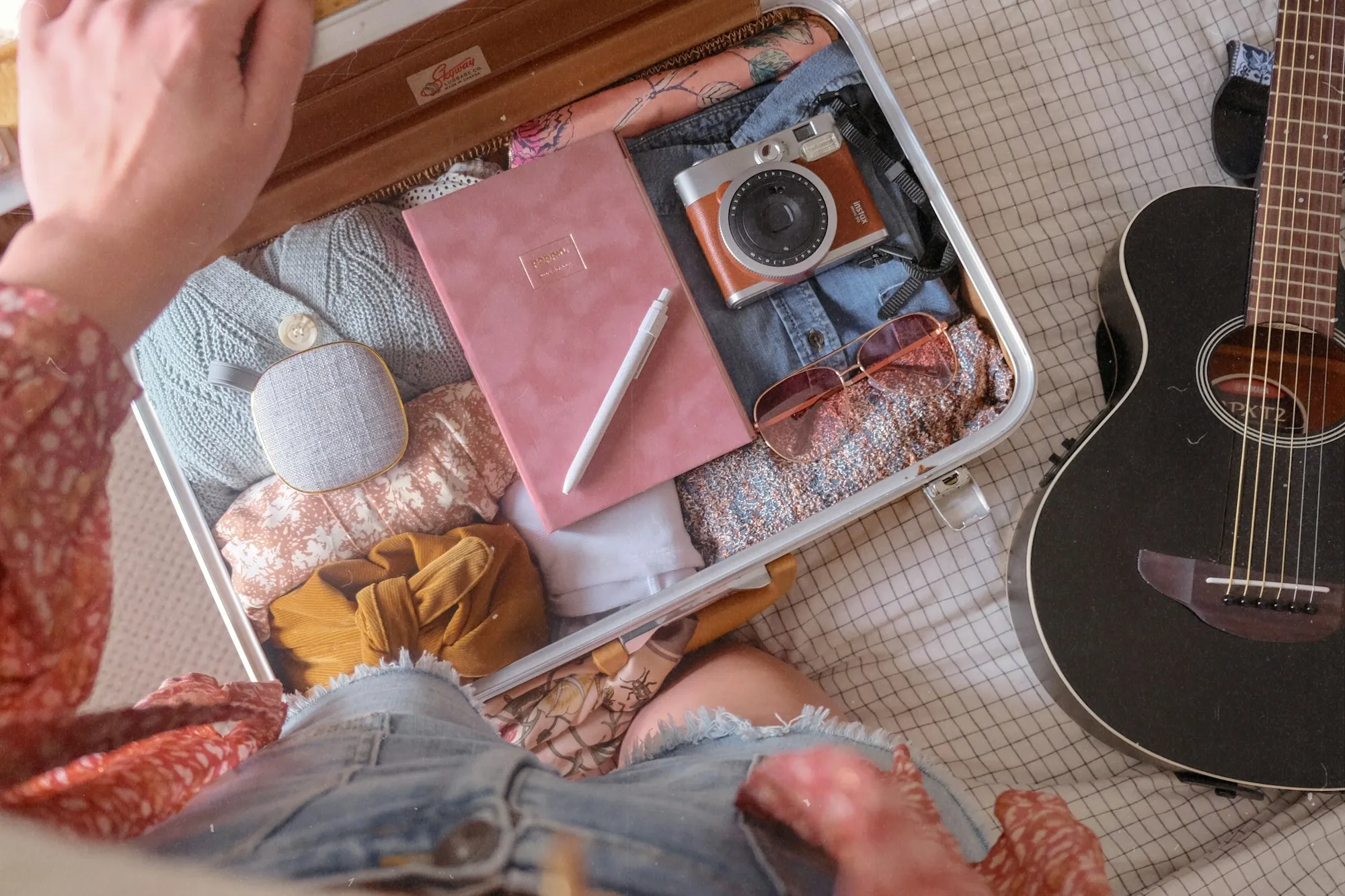 Open suitcase being packed for a trip